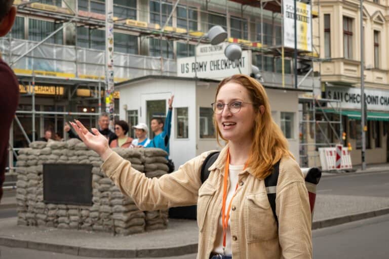 Local expert Natalie standing in front of Checkpoint Charlie