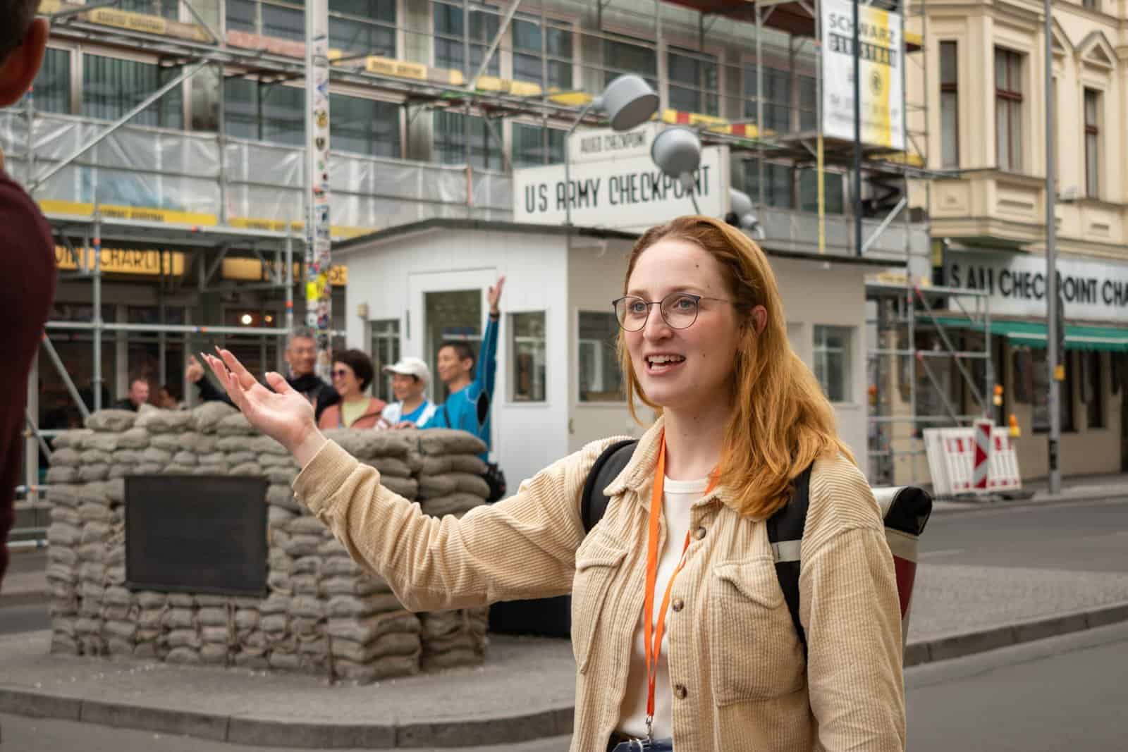 Local expert Natalie standing in front of Checkpoint Charlie