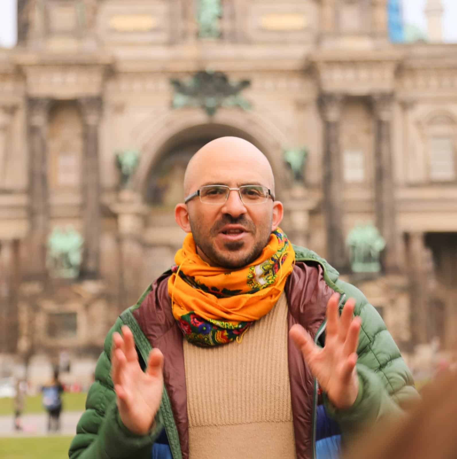 Local expert Beny standing in front of a landmark in Berlin